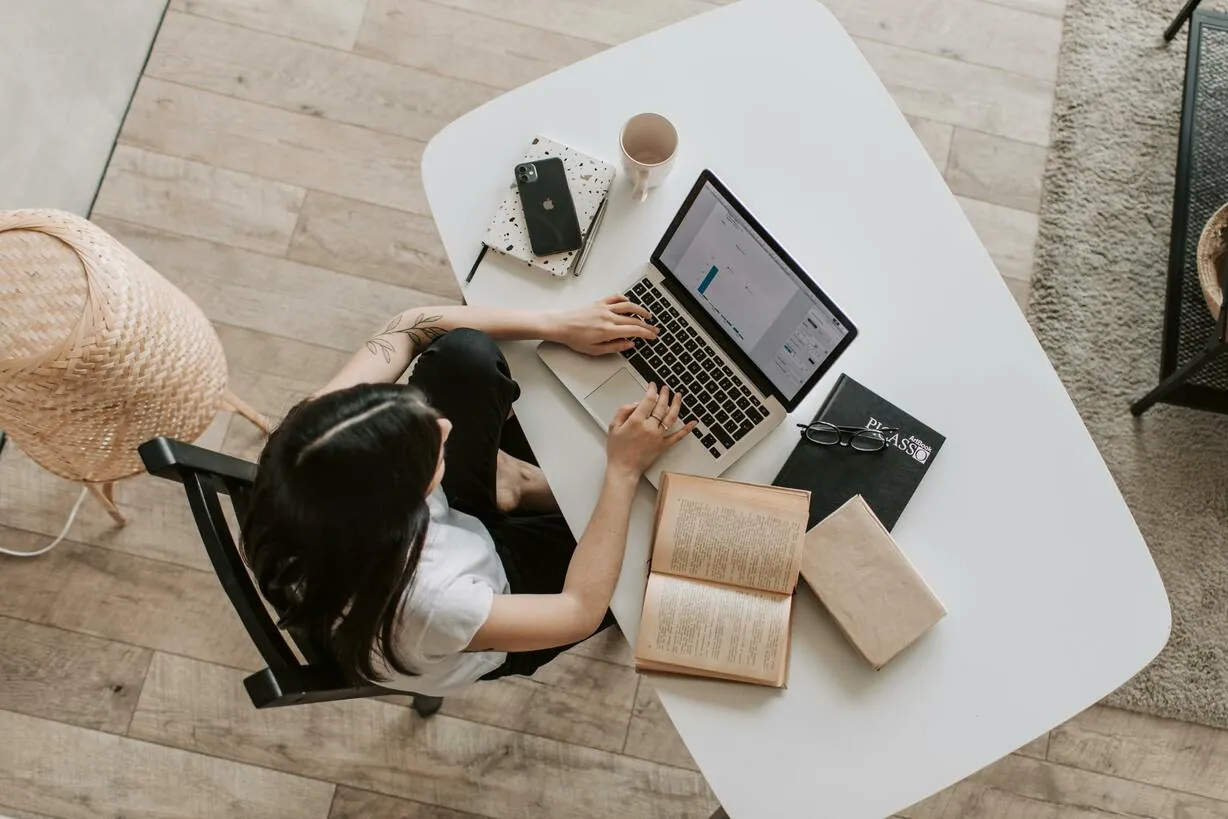 Person researching the real estate market on a laptop at home